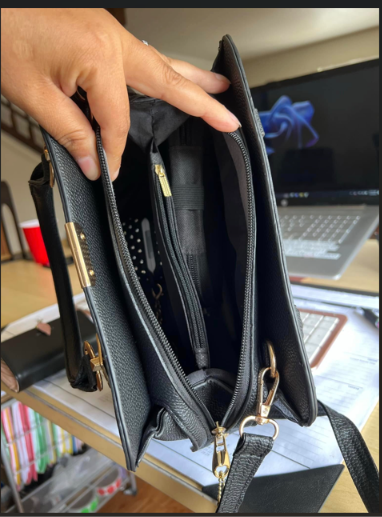 Open handbag showing interior compartments