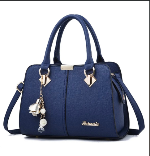 Blue handbag with twin handles and shoulder strap